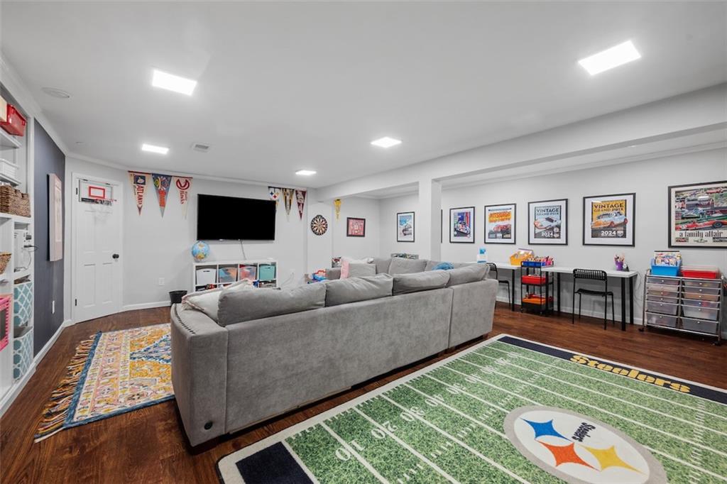 1014 Osage Road Pittsburgh, PA 15243 - Photo 38 of 49 a living room with furniture and a flat screen tv
