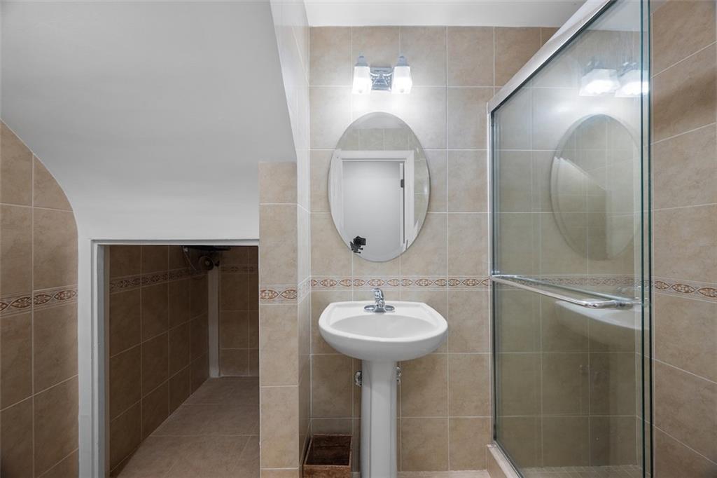 1014 Osage Road Pittsburgh, PA 15243 - Photo 40 of 49 a bathroom with a sink and a mirror
