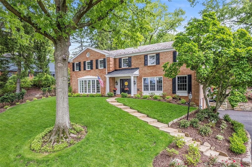 1014 Osage Road Pittsburgh, PA 15243 - Photo 46 of 49 a front view of a house with a yard and trees