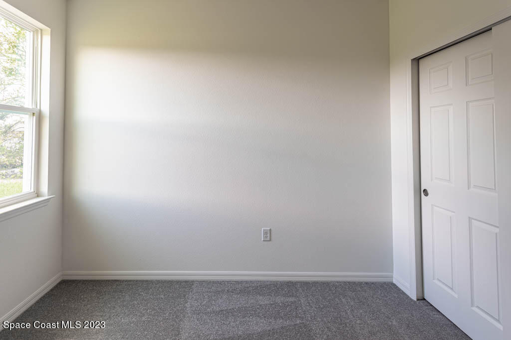 174 Compass Titusville, FL 32796 - Photo 25 of 32 an empty room with a window