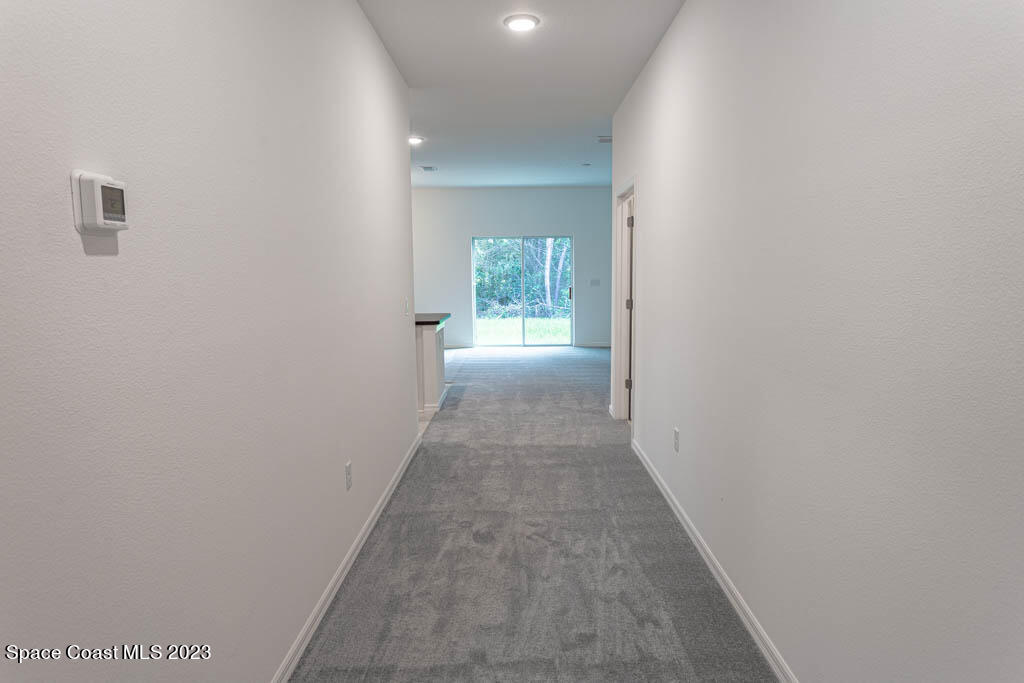 174 Compass Titusville, FL 32796 - Photo 3 of 32 a view of a hallway with a window