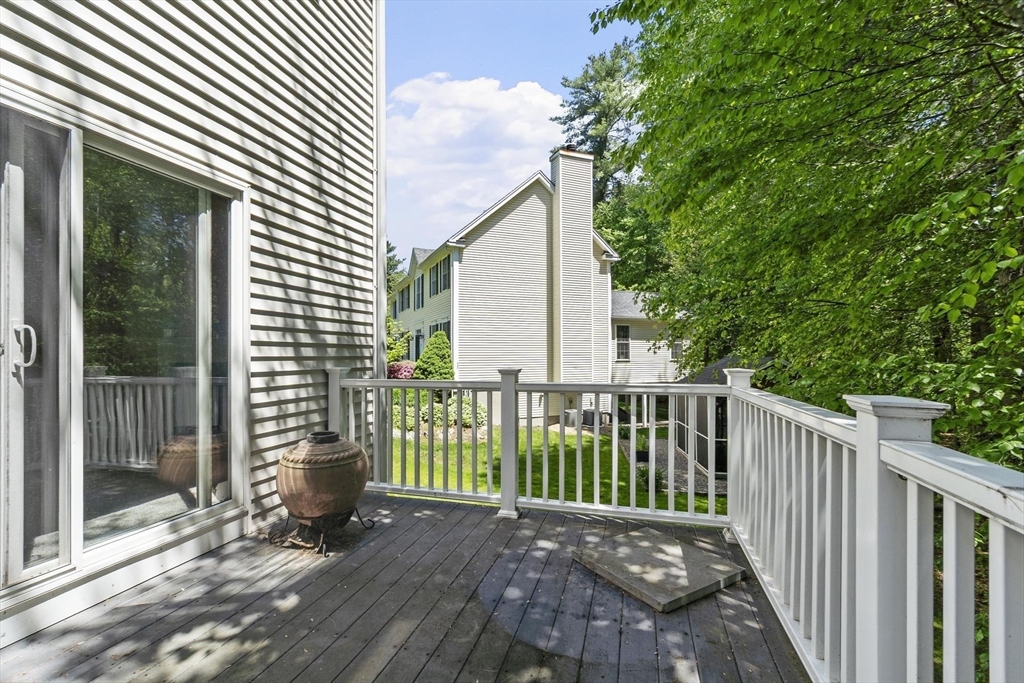4 Forest Street Georgetown, MA 01833 - Photo 32 of 37 a view of a deck with wooden floor and fence