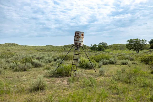a view of a lake with houses in the back