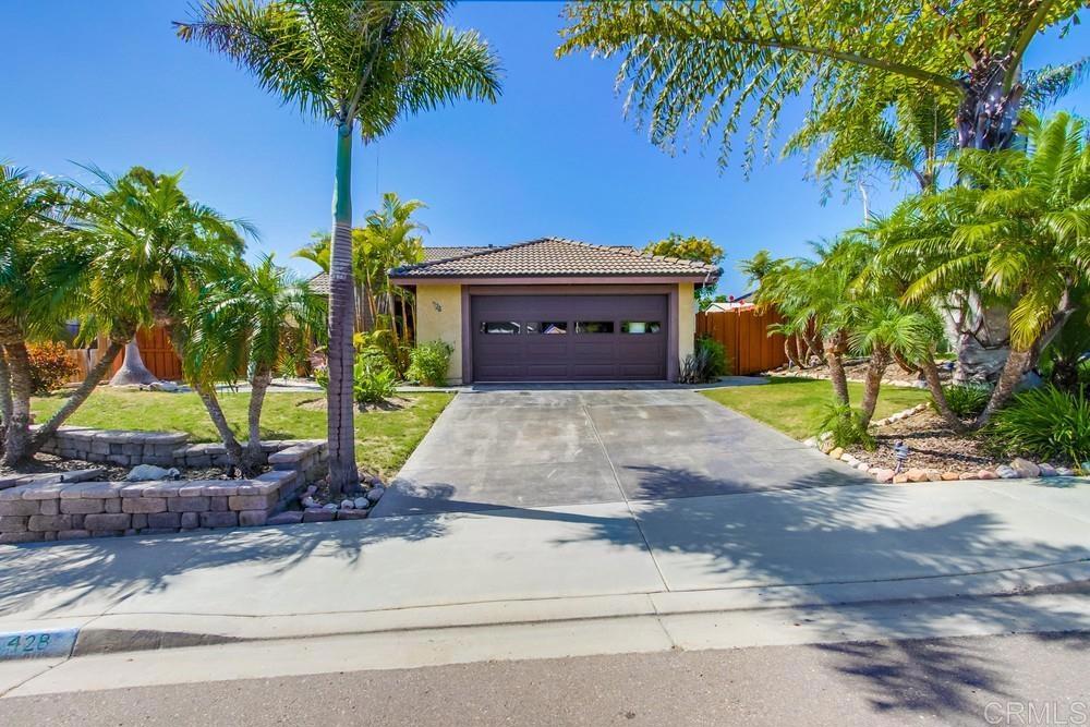 a house view with a garden space