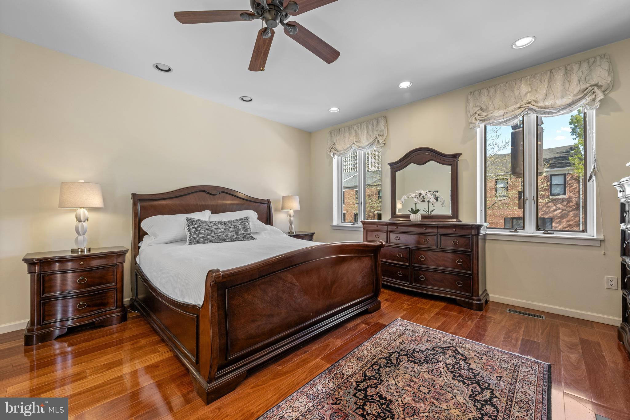 303 Spruce Street Philadelphia, PA 19106 - Photo 12 of 30 a bedroom with a bed and wooden floor