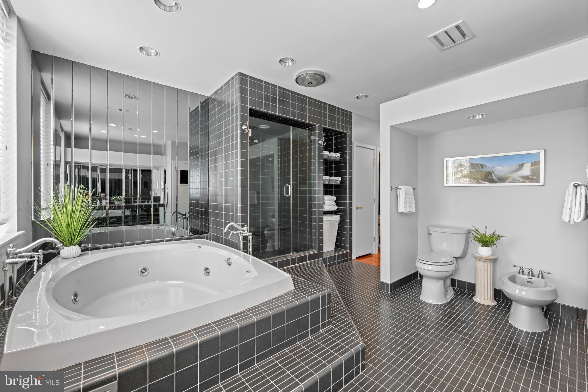 303 Spruce Street Philadelphia, PA 19106 - Photo 14 of 30 a spacious bathroom with a bathtub and a shower