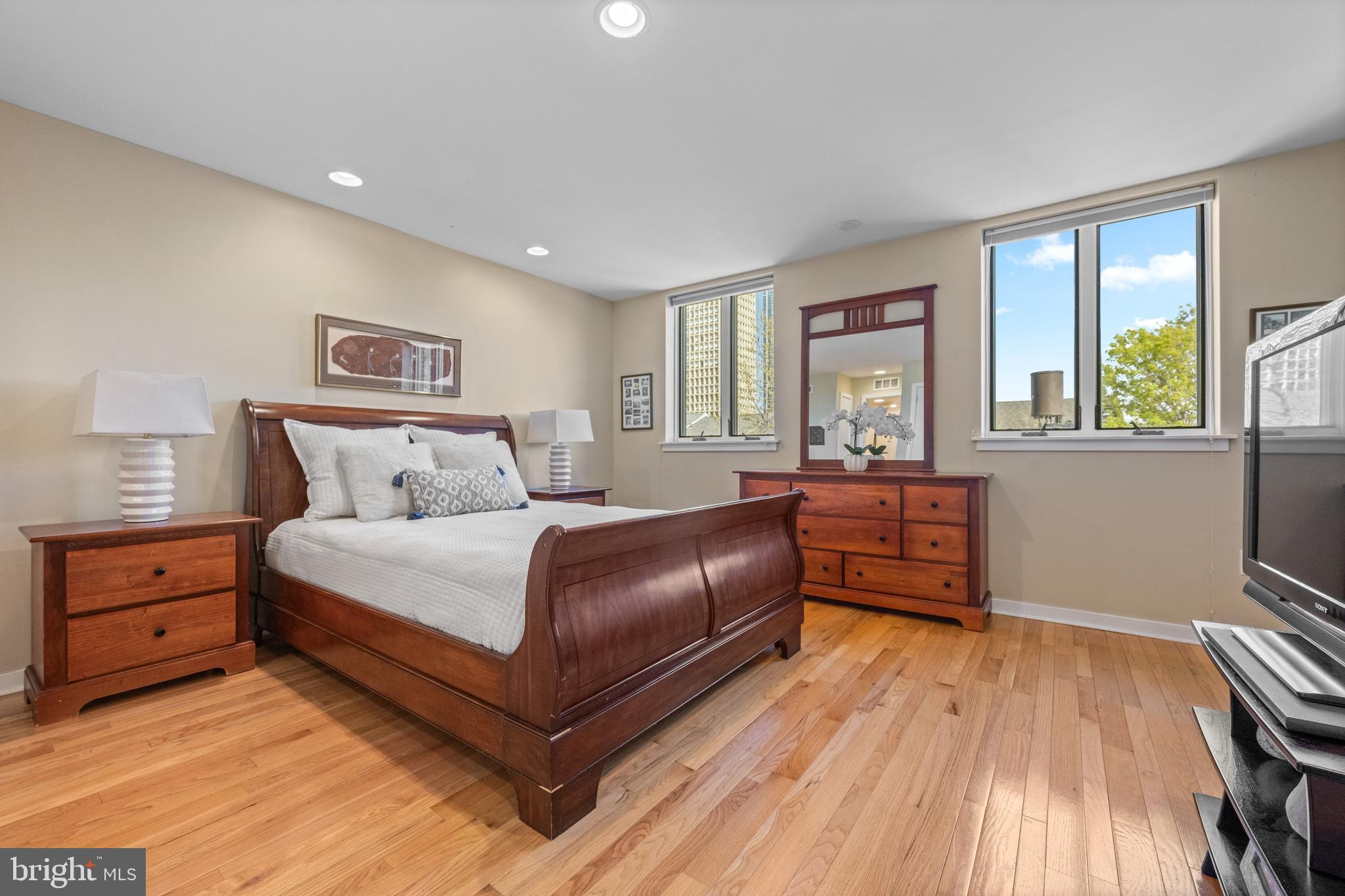 303 Spruce Street Philadelphia, PA 19106 - Photo 16 of 30 a bedroom with a bed and wooden floor