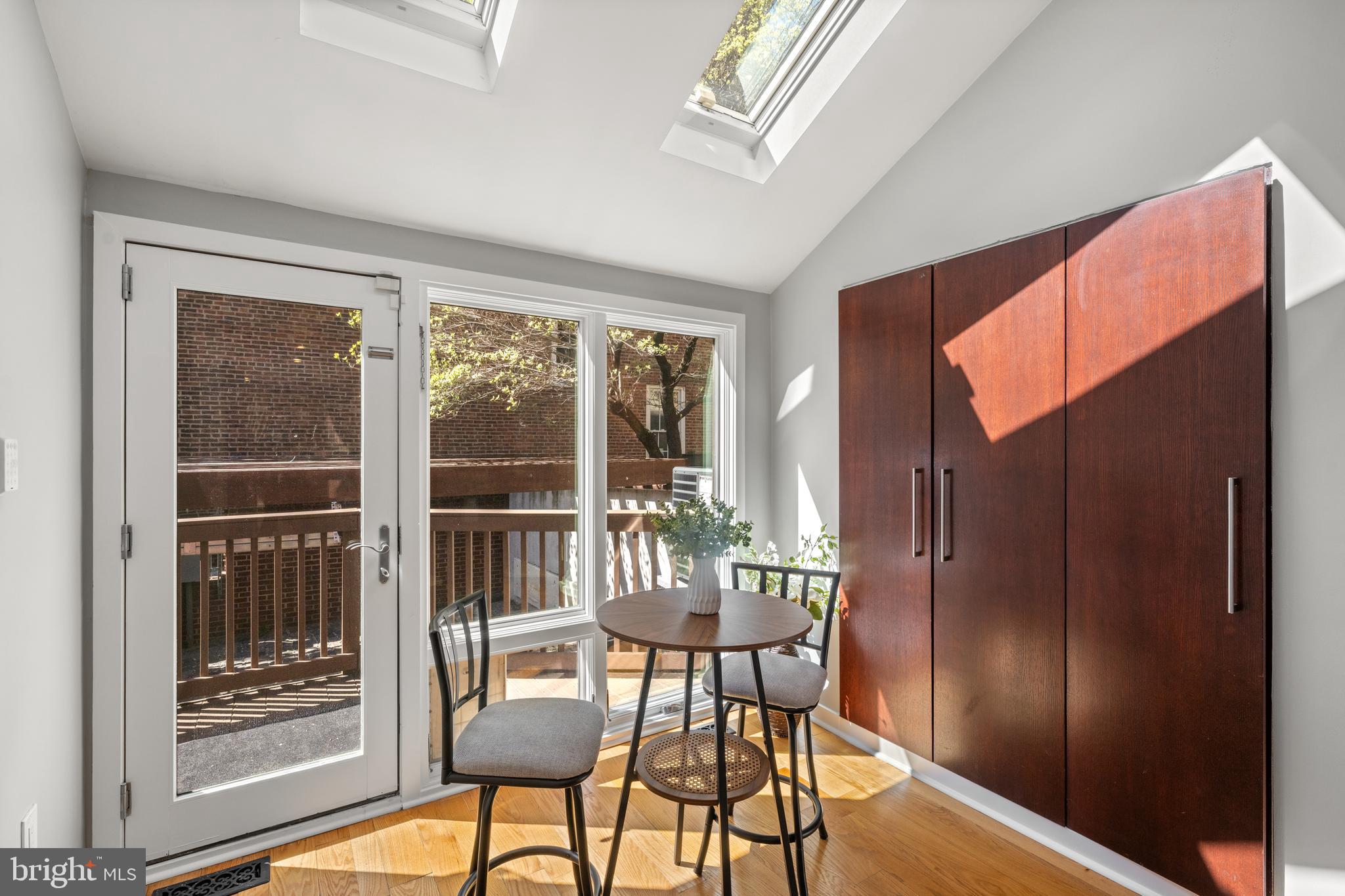 303 Spruce Street Philadelphia, PA 19106 - Photo 10 of 30 a view of a dining room with furniture window and wooden floor