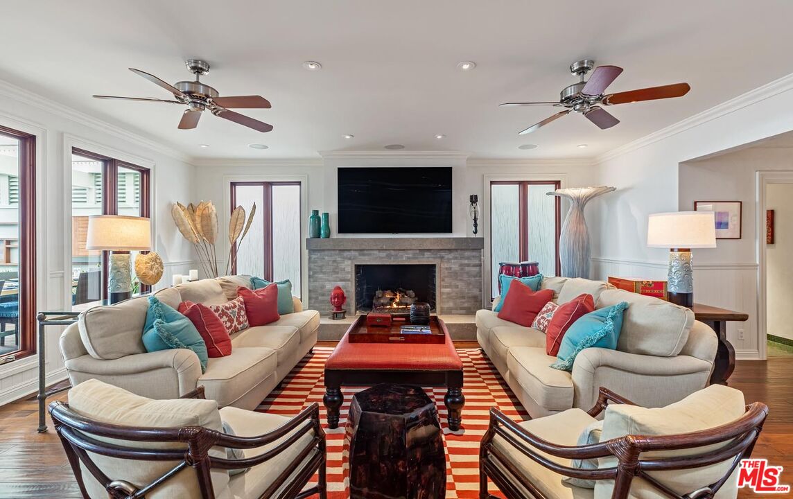 23416 Malibu Colony Road Malibu, CA 90265 - Photo 7 of 26 a living room with furniture and a fireplace