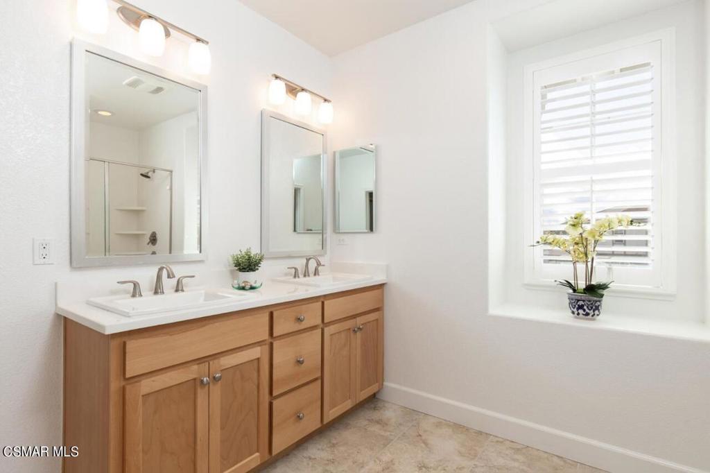 217 9th Street Marina, CA 93933 - Photo 14 of 17 a bathroom with a sink double vanity and a mirror