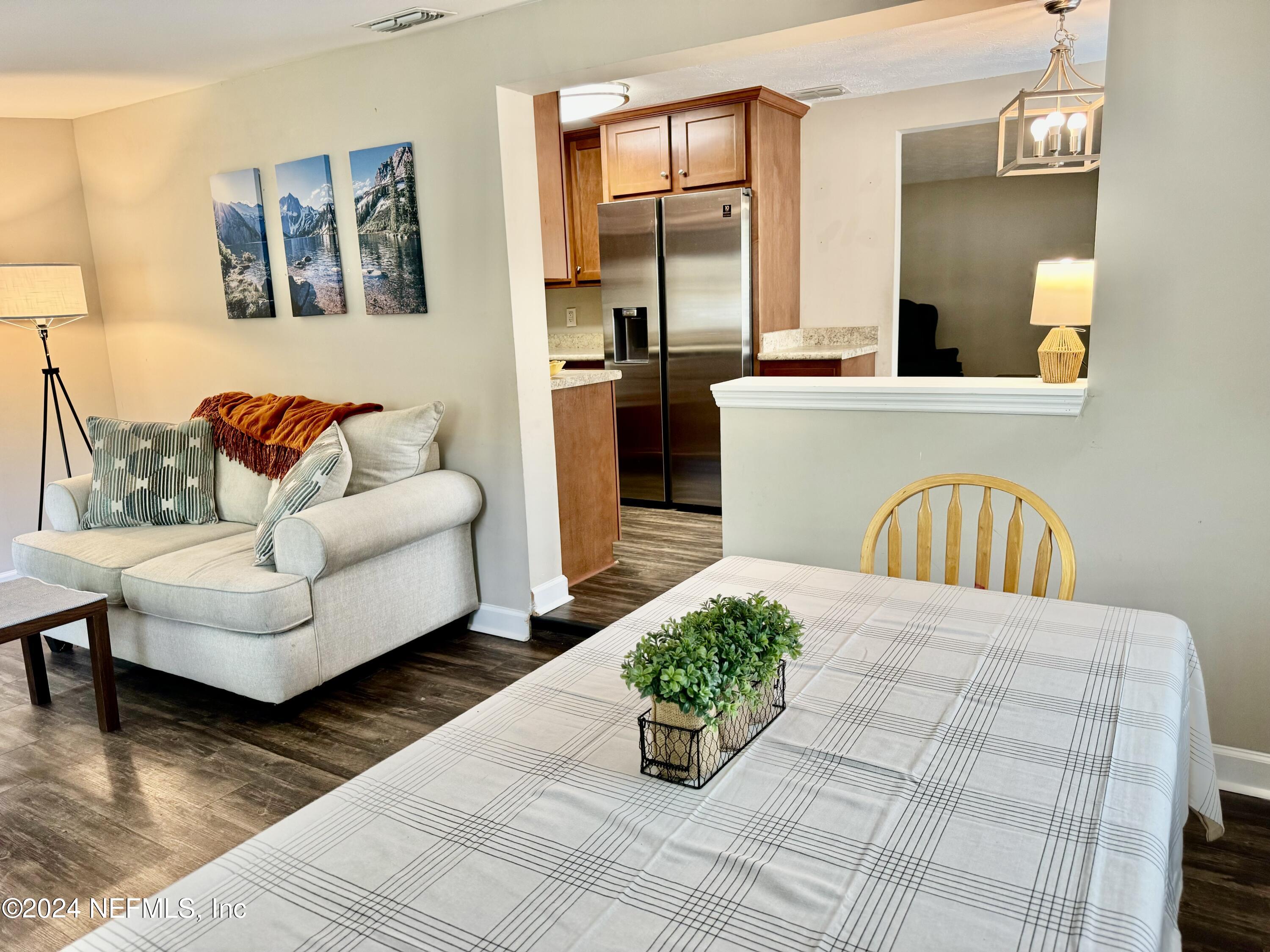 398 Gwinnett Road Orange Park, FL 32073 - Photo 13 of 40 a living room with furniture and wooden floor