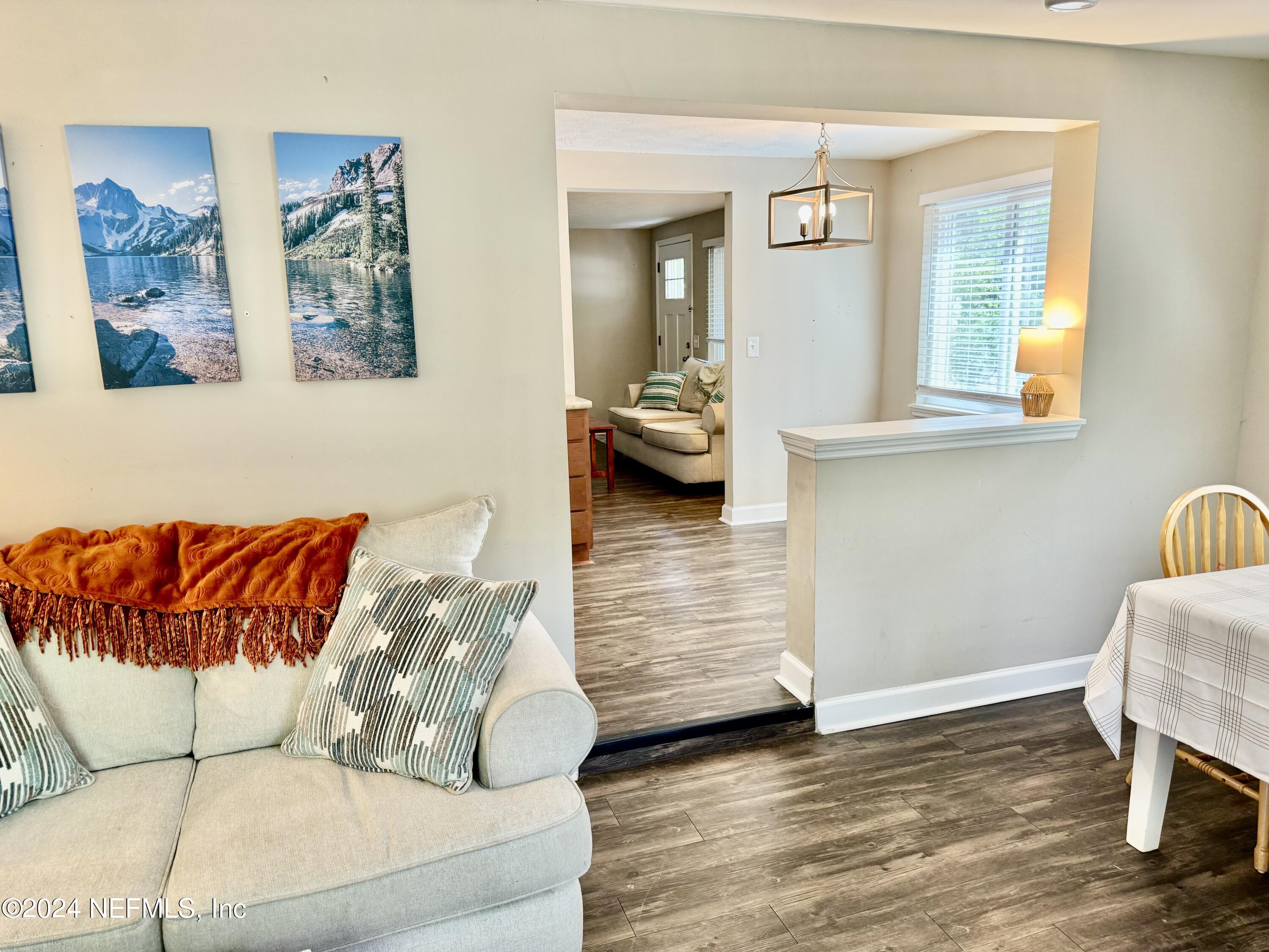 398 Gwinnett Road Orange Park, FL 32073 - Photo 14 of 40 a living room with furniture and wooden floor