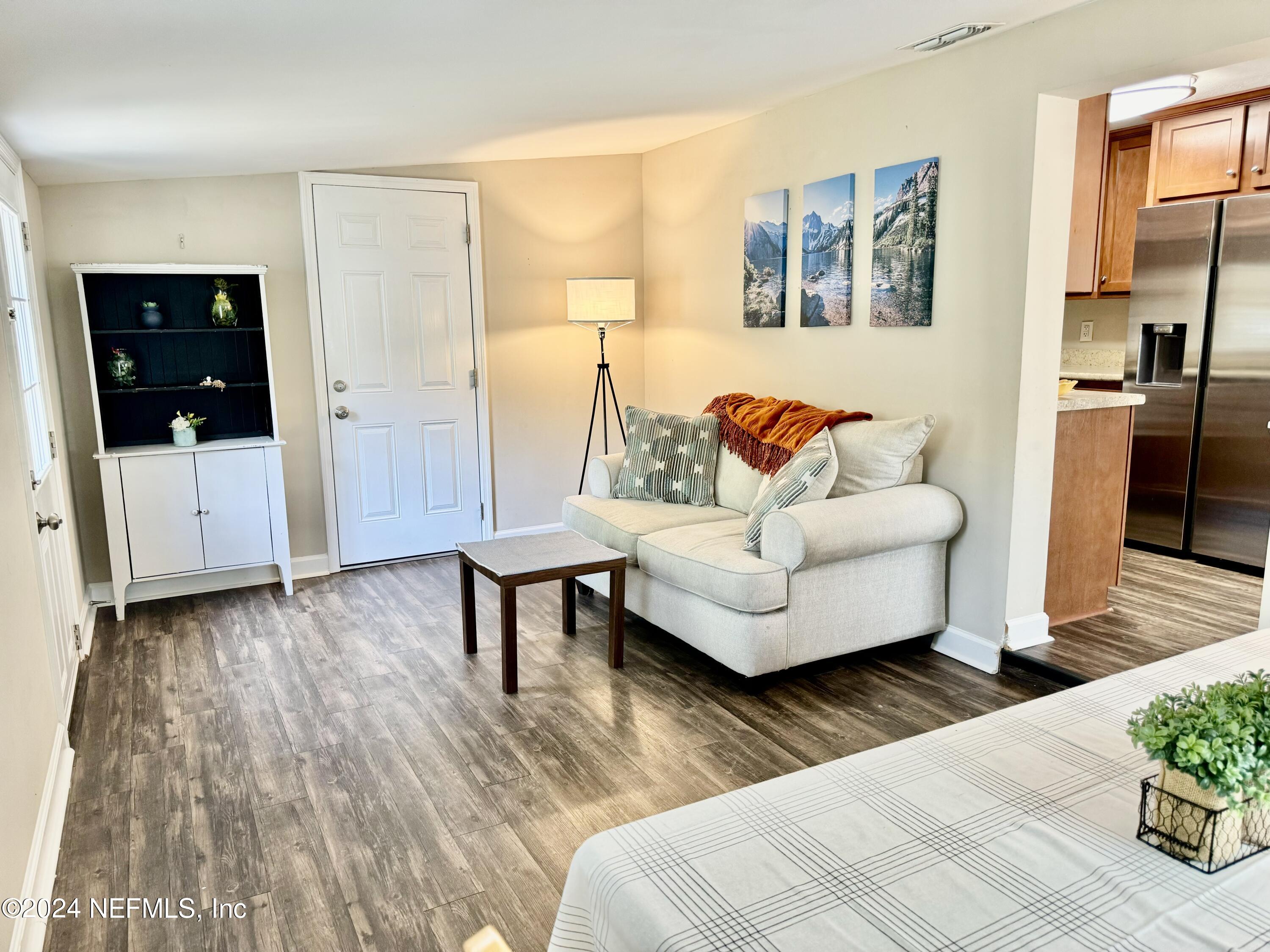 398 Gwinnett Road Orange Park, FL 32073 - Photo 16 of 40 a living room with furniture and a gate