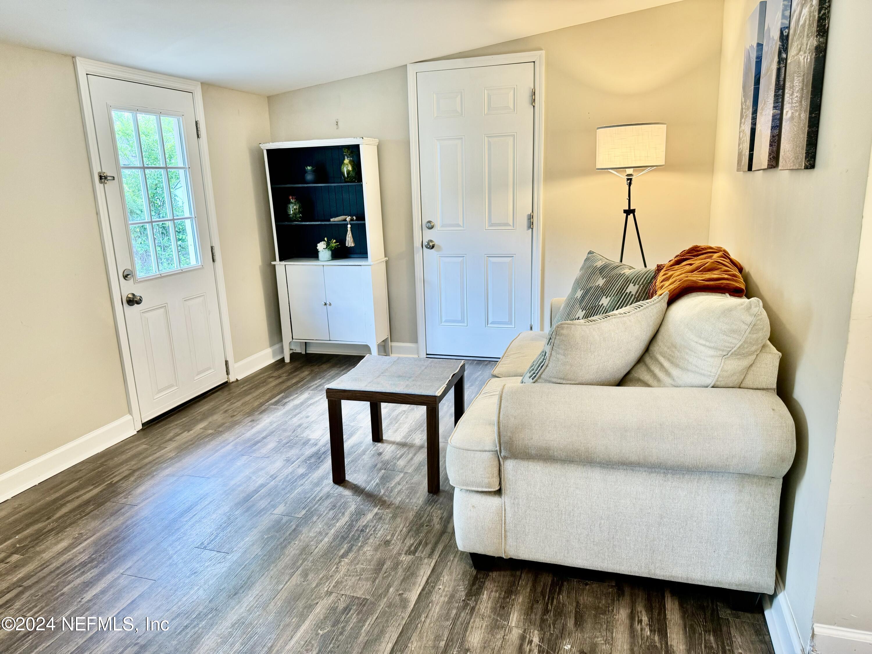 398 Gwinnett Road Orange Park, FL 32073 - Photo 17 of 40 a living room with furniture and wooden floor
