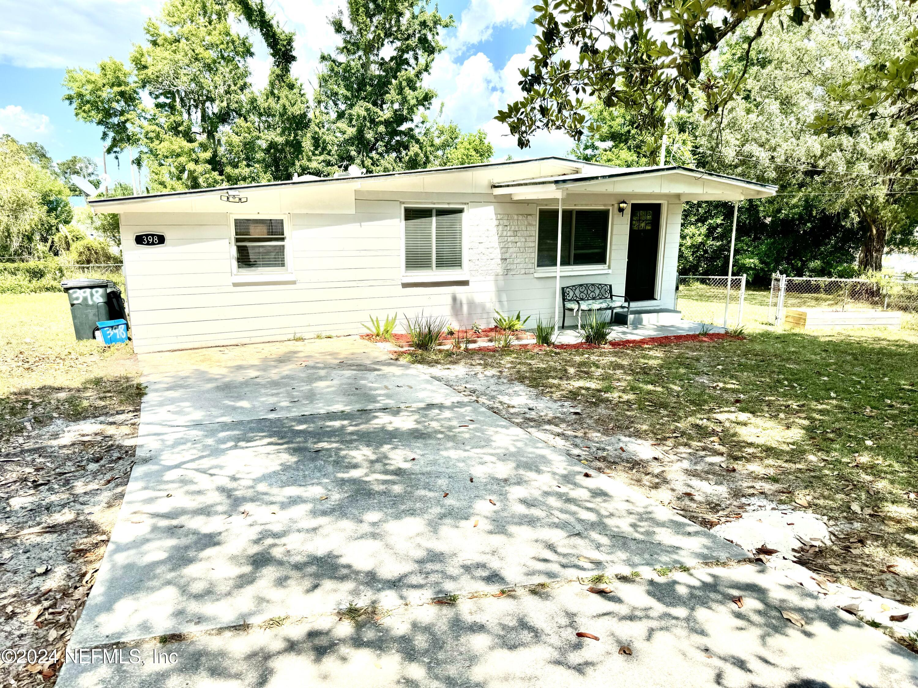 398 Gwinnett Road Orange Park, FL 32073 - Photo 2 of 40 a view of a house with backyard and sitting area