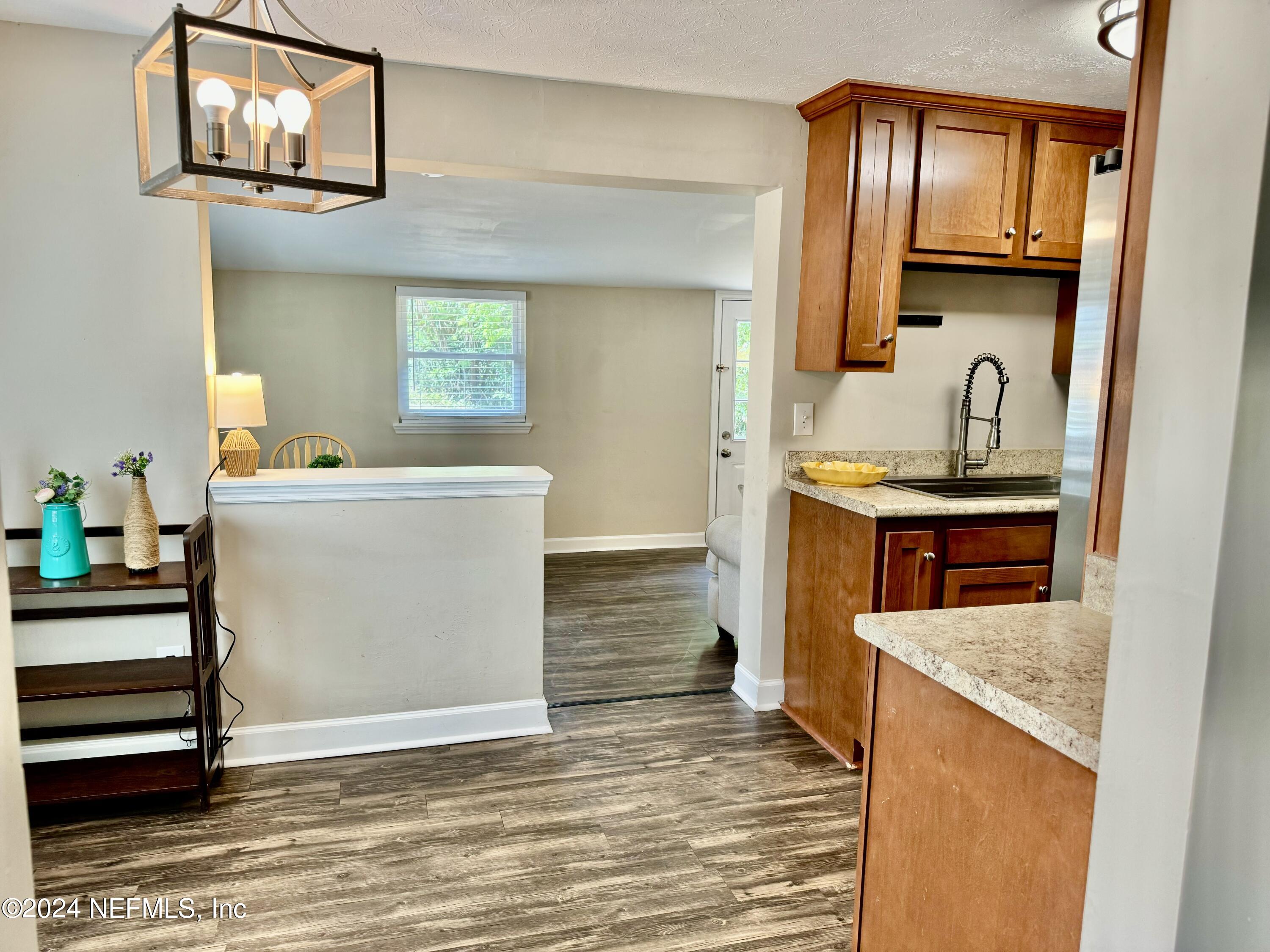 398 Gwinnett Road Orange Park, FL 32073 - Photo 22 of 40 a kitchen with stainless steel appliances granite countertop a sink stove and cabinets