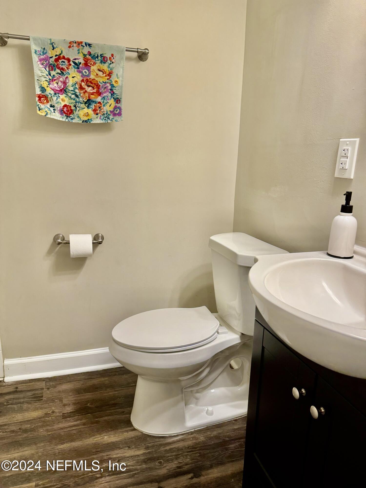 398 Gwinnett Road Orange Park, FL 32073 - Photo 26 of 40 a white toilet sitting next to a bathroom sink