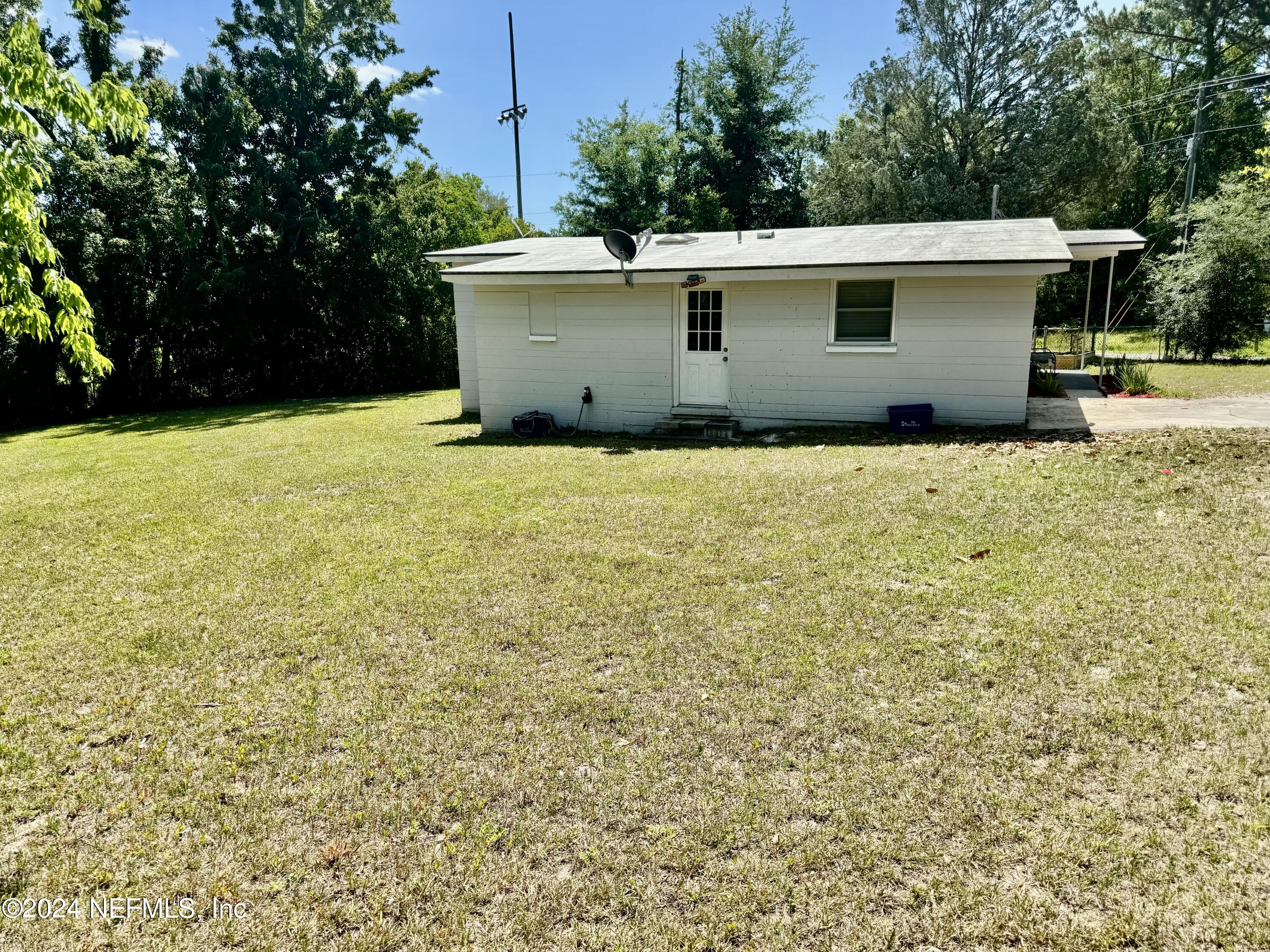 398 Gwinnett Road Orange Park, FL 32073 - Photo 35 of 40 a view of a outdoor space with a patio and yard