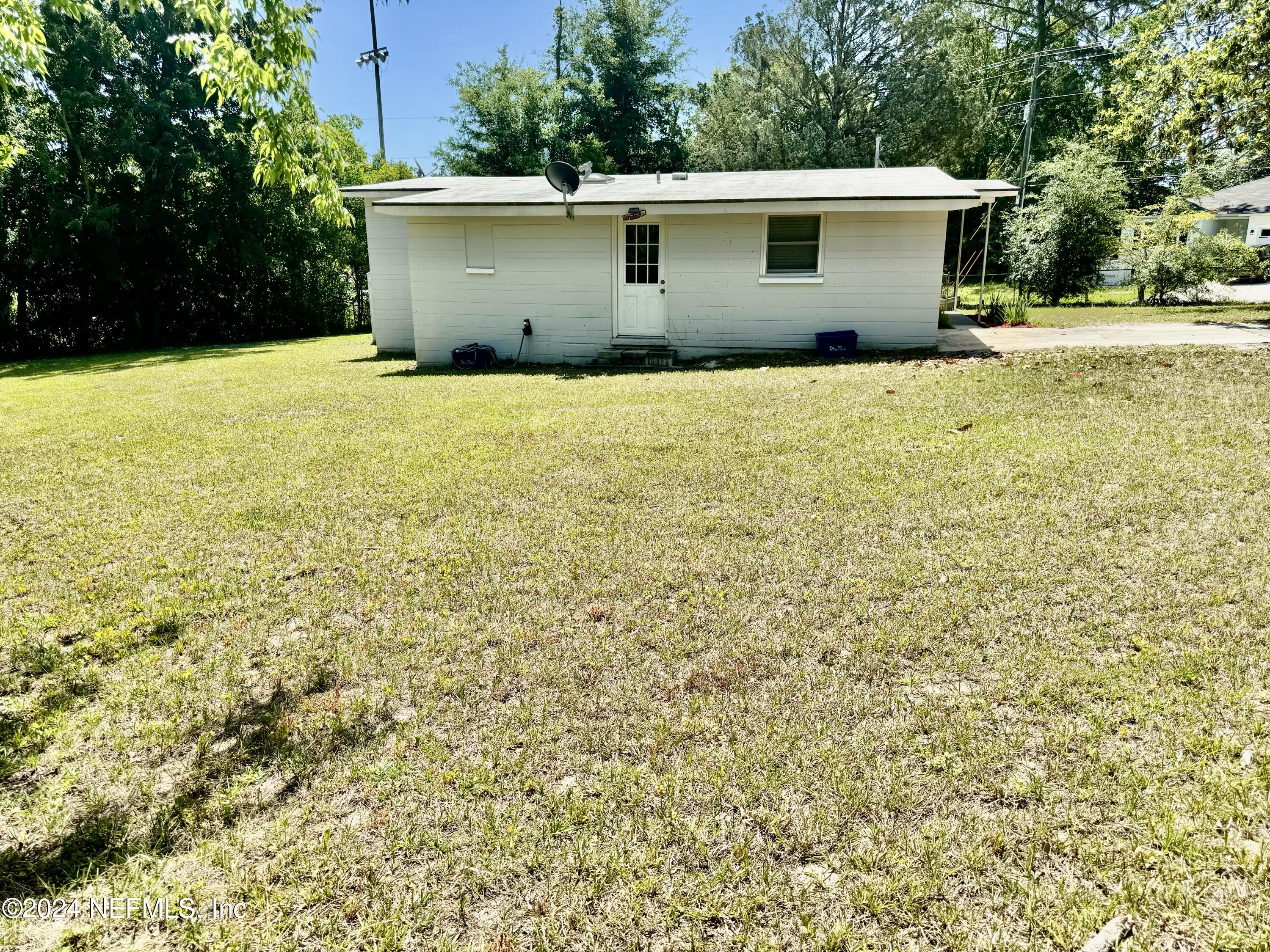 398 Gwinnett Road Orange Park, FL 32073 - Photo 36 of 40 a view of a house with a yard