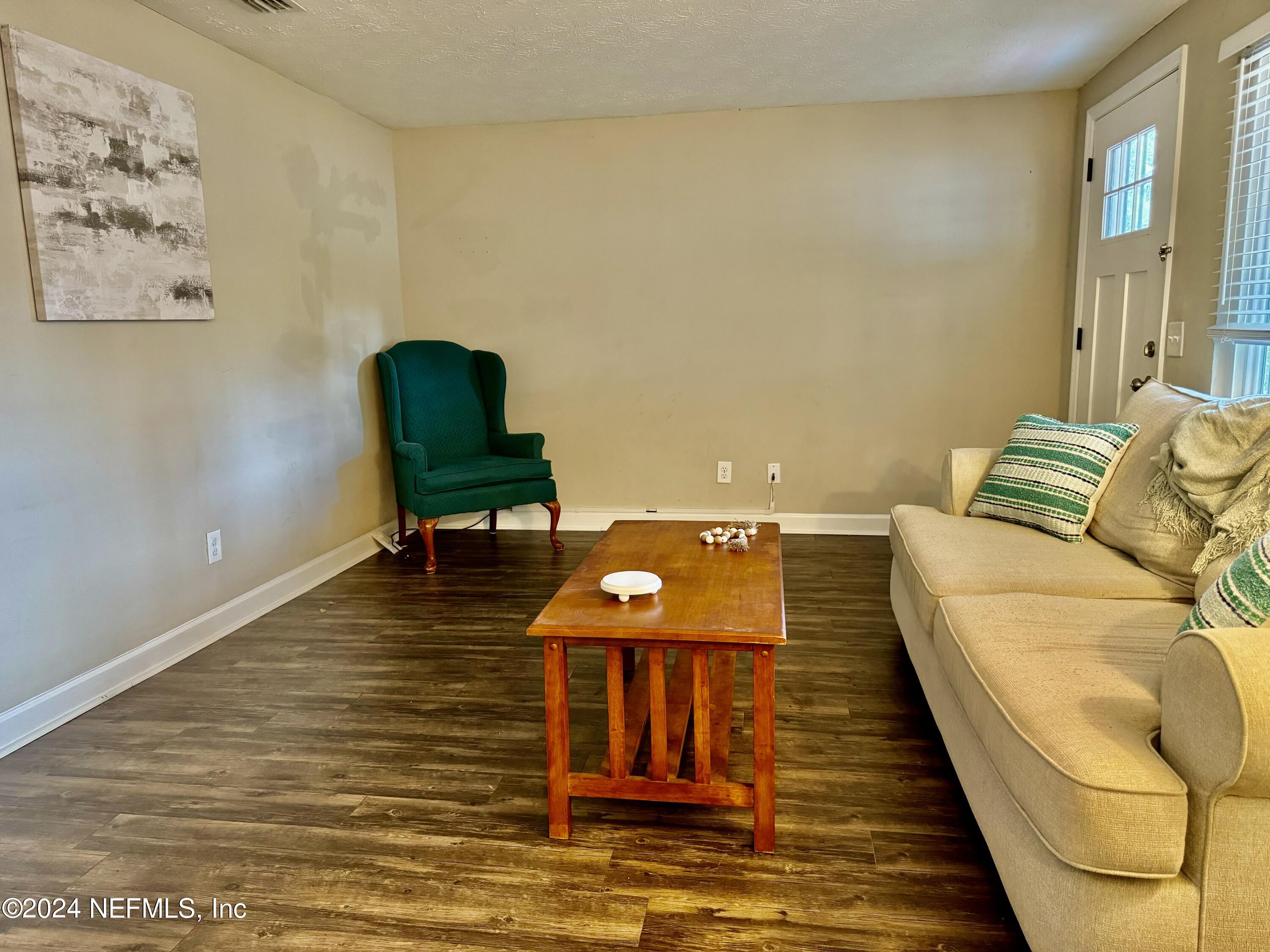 398 Gwinnett Road Orange Park, FL 32073 - Photo 7 of 40 a living room with furniture and a wooden floor