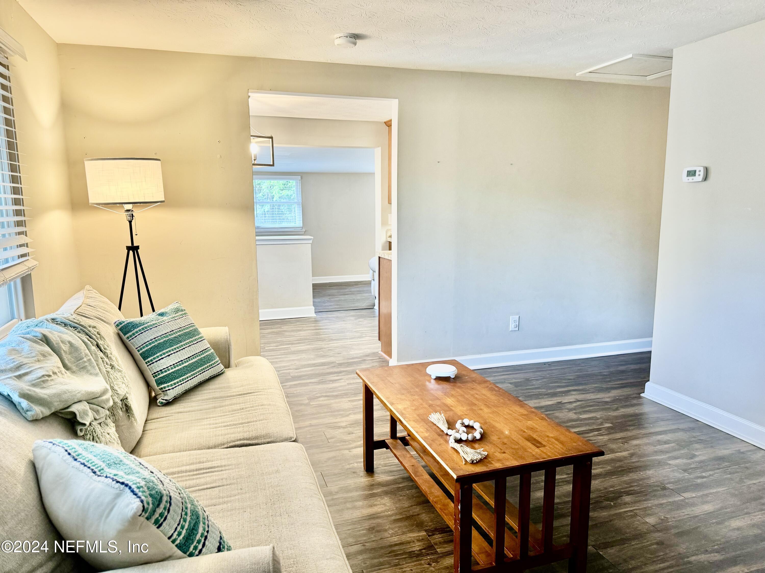 398 Gwinnett Road Orange Park, FL 32073 - Photo 8 of 40 a living room with furniture and a wooden floor
