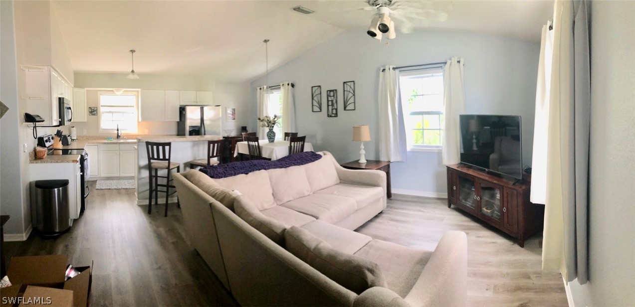 8133 Albatross Road Fort Myers, FL 33967 - Photo 12 of 14 a living room with furniture and a flat screen tv