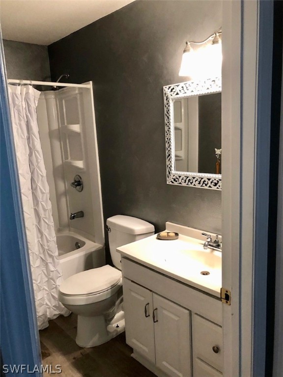 8133 Albatross Road Fort Myers, FL 33967 - Photo 8 of 14 a bathroom with a granite countertop sink toilet and shower