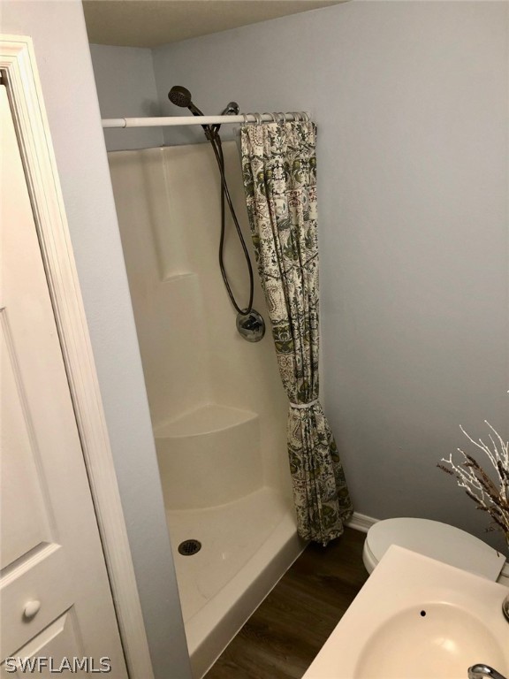 8133 Albatross Road Fort Myers, FL 33967 - Photo 9 of 14 a bathroom with a bathtub and shower