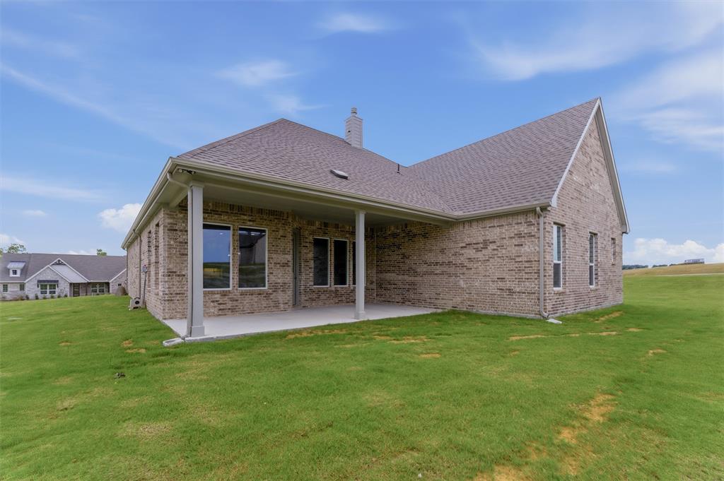 906 Perrin Lane Van Alstyne, TX 75495 - Photo 29 of 30 a view of a house with a yard and pathway