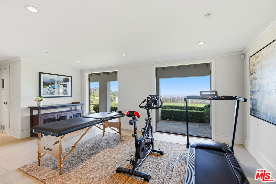 980 Stradella Road Los Angeles, CA 90077 - Photo 18 of 40 a view of a room with gym equipment