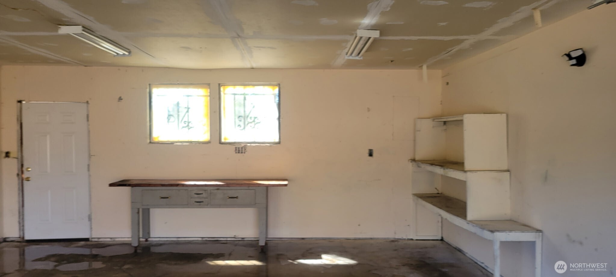 12524 Addison Street Southwest Lakewood, WA 98499 - Photo 13 of 20 a room with a table and a mirror