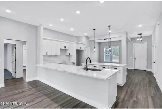 a kitchen with counter top space and a sink