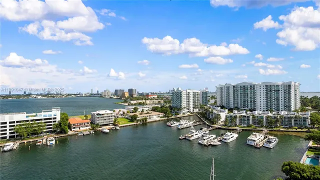 a view of a lake with couches chairs and city view
