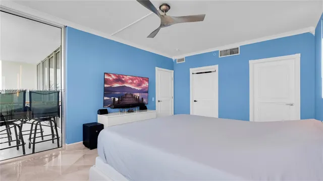 a bedroom with a bed and glass wall painting