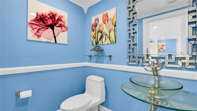 a dining room with table chairs and a chandelier