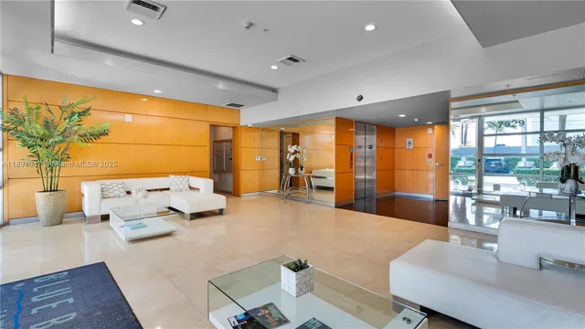 a large bedroom with a large bed and furniture