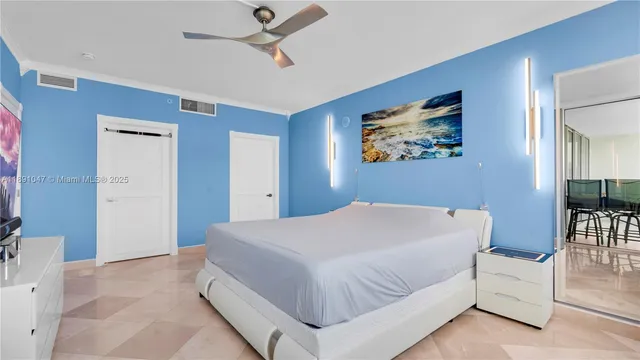 a bedroom with a bed and a couch