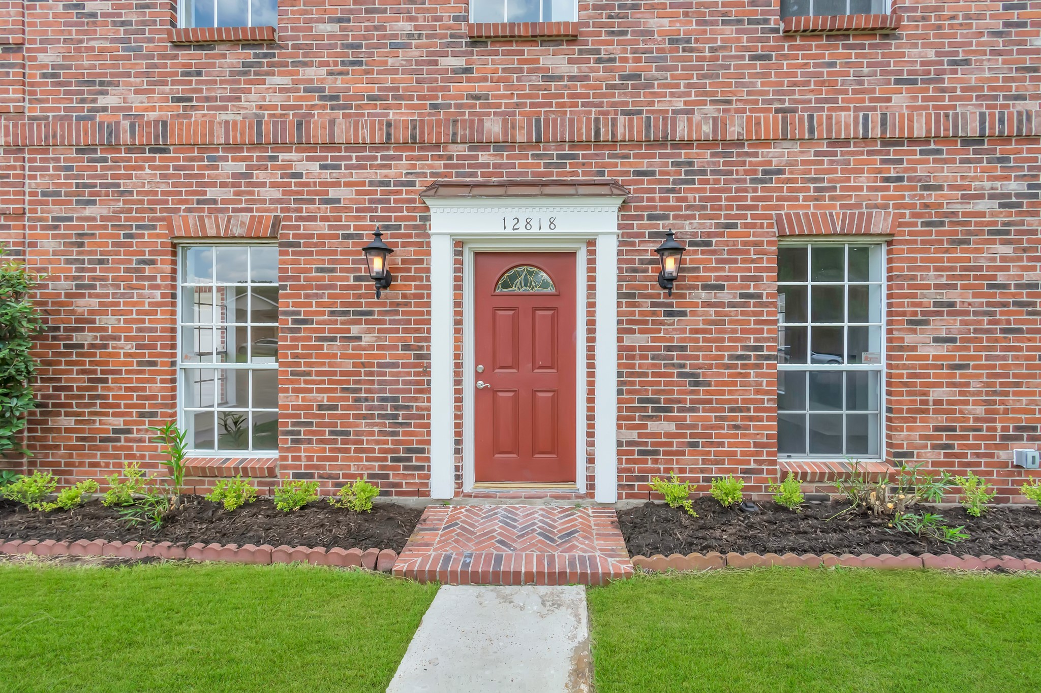 12818 Chamberlain Drive Houston, TX 77077 - Photo 2 of 32 a front view of a house with garden