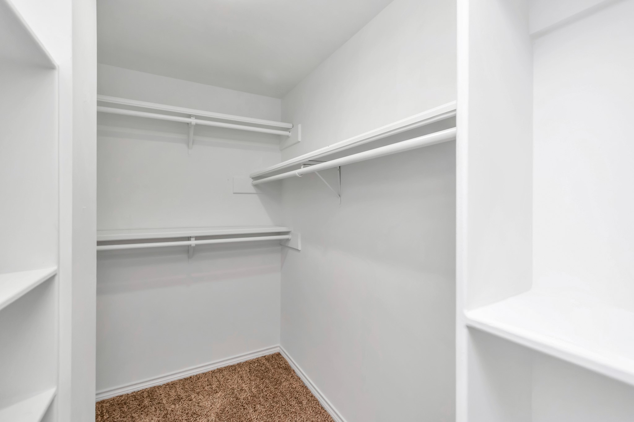 12818 Chamberlain Drive Houston, TX 77077 - Photo 23 of 32 a view of an empty walk in closet