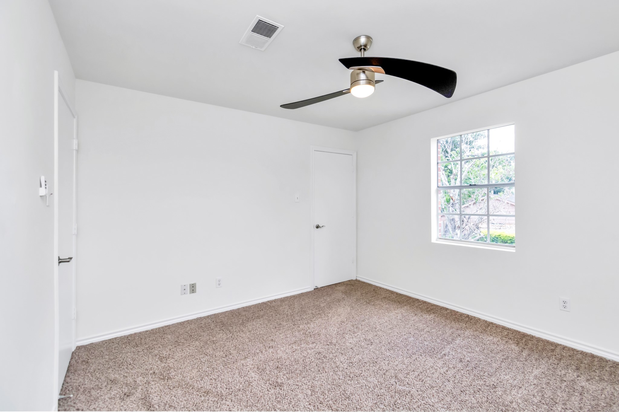 12818 Chamberlain Drive Houston, TX 77077 - Photo 25 of 32 a view of an empty room with a window