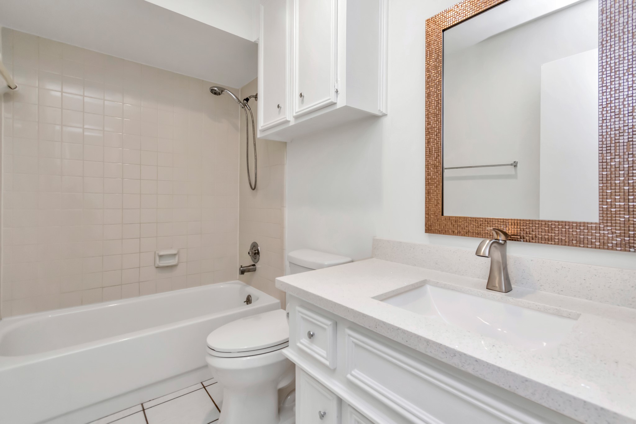 12818 Chamberlain Drive Houston, TX 77077 - Photo 28 of 32 a bathroom with a sink a toilet and a bathtub