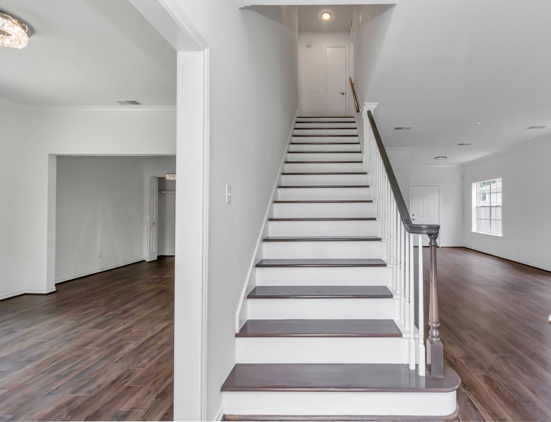 12818 Chamberlain Drive Houston, TX 77077 - Photo 4 of 32 a view of an entryway with wooden floor