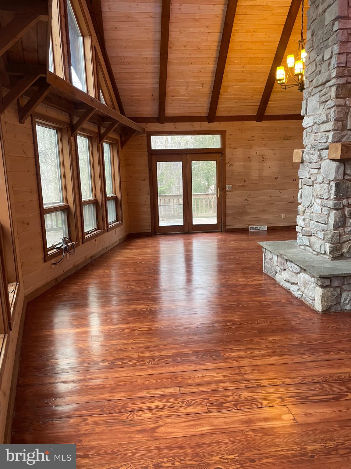 506 Hemlock Lane Lebanon, PA 17042 - Photo 16 of 63 a view of an empty room with wooden floor and a window