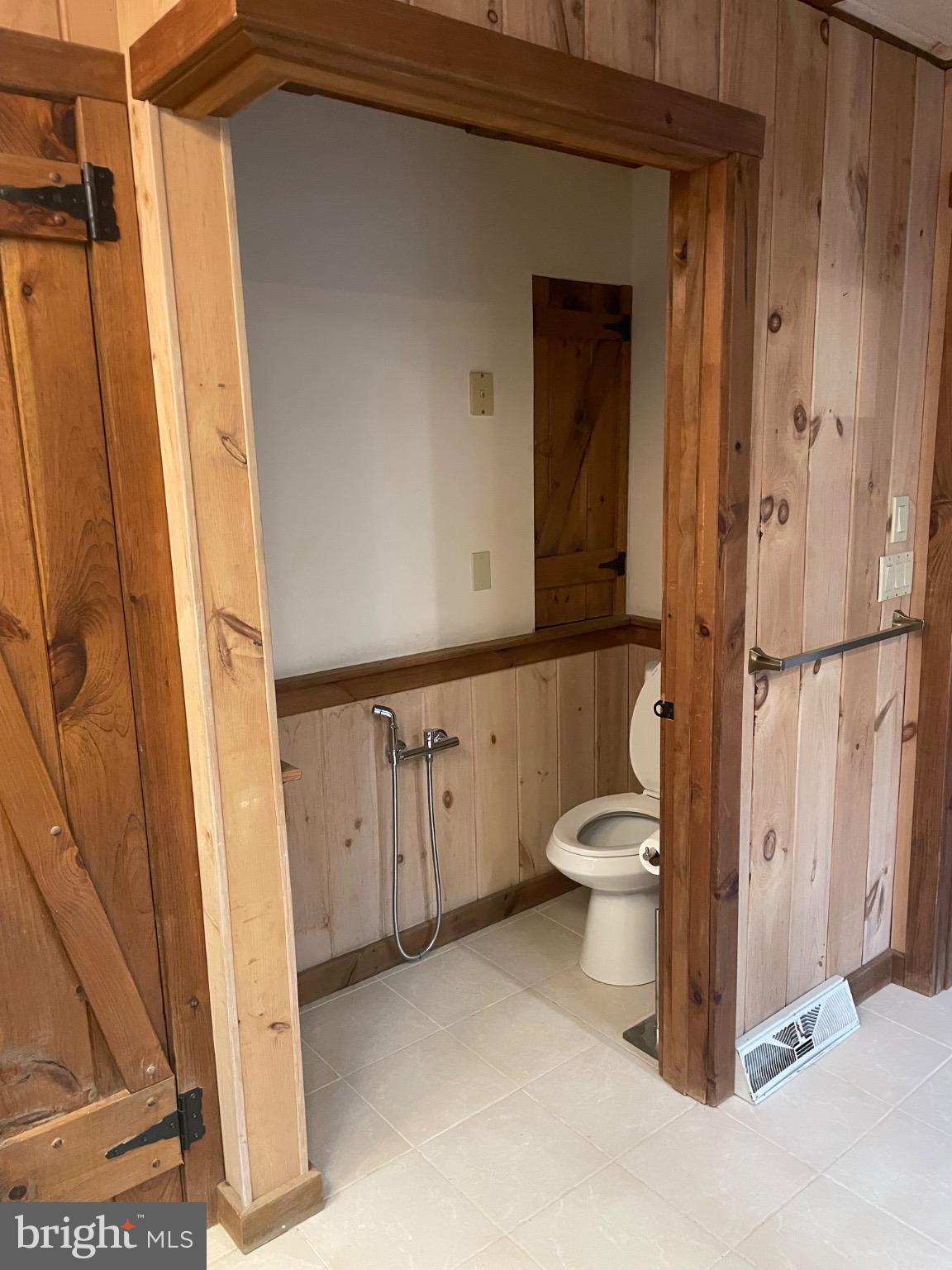 506 Hemlock Lane Lebanon, PA 17042 - Photo 26 of 63 a bathroom with a granite countertop toilet a sink and a mirror