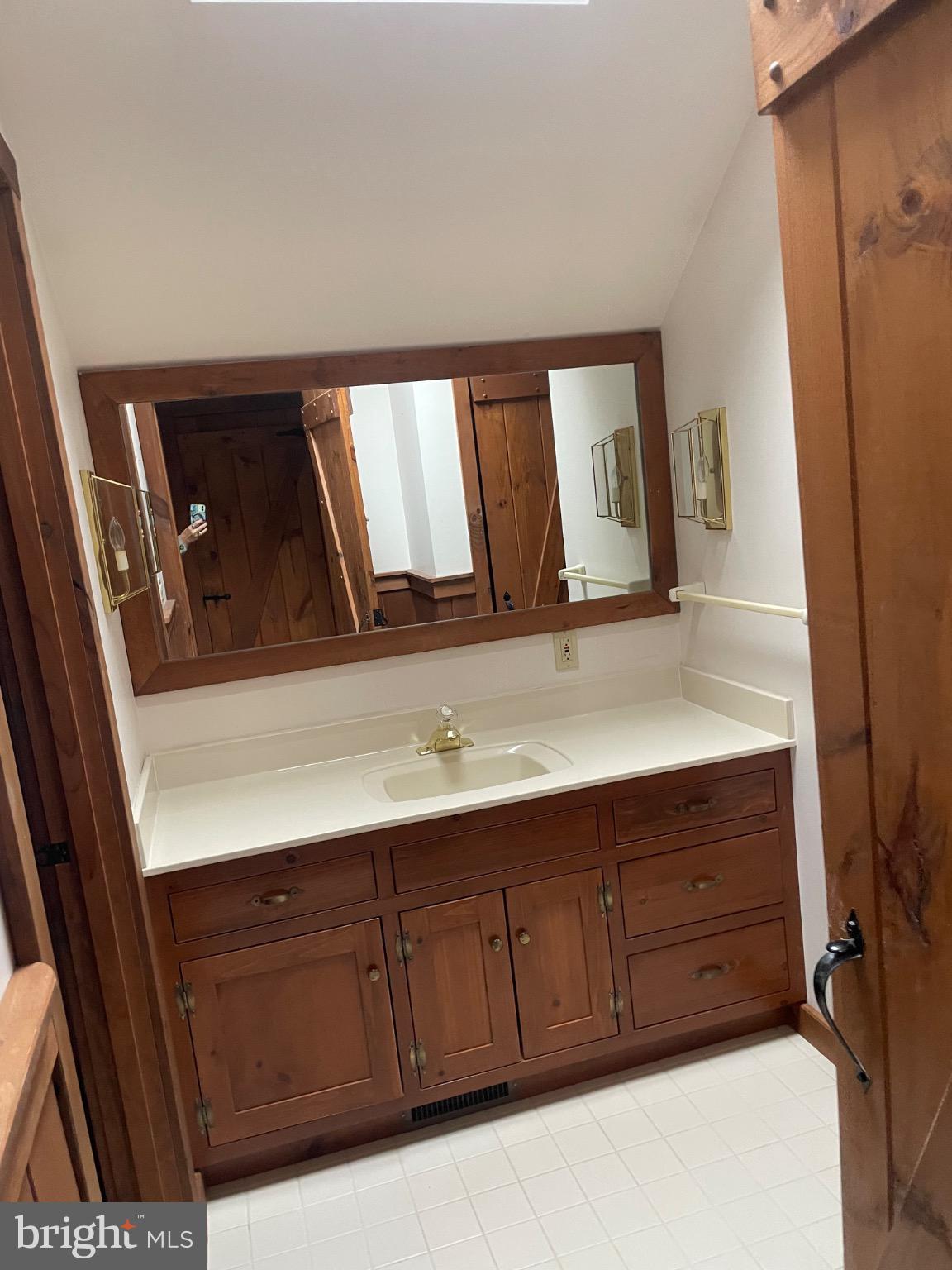 506 Hemlock Lane Lebanon, PA 17042 - Photo 29 of 63 a bathroom with a sink a vanity and mirror