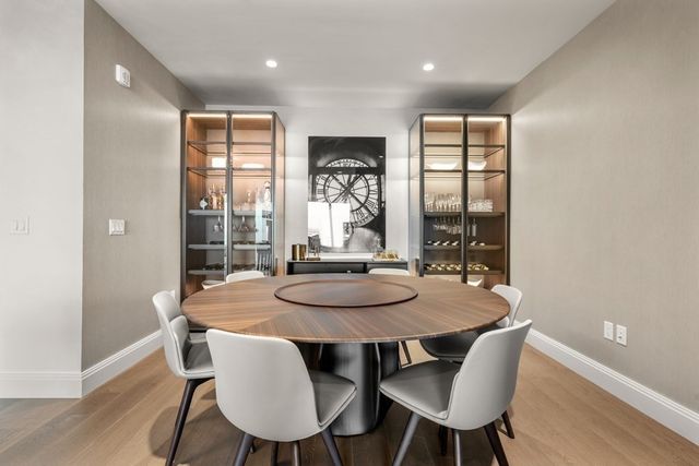a dining room with furniture and window