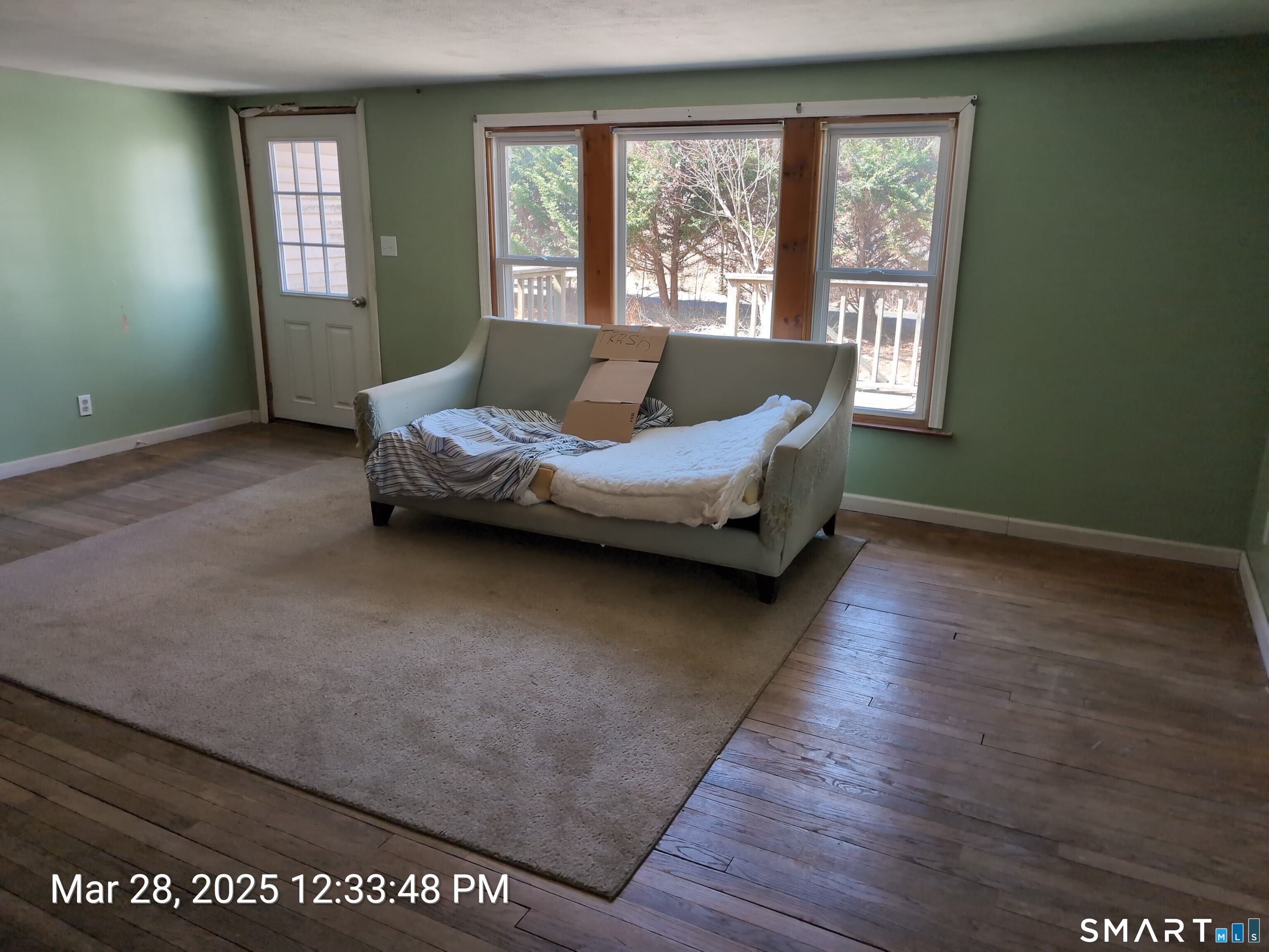 97 Bushy Hill Road Deep River, CT 06417 - Photo 20 of 28 a living room with a bed furniture and a window