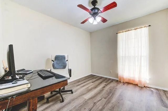 a workspace with furniture and window