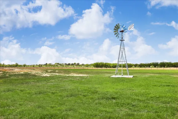 a view of yard with mountain