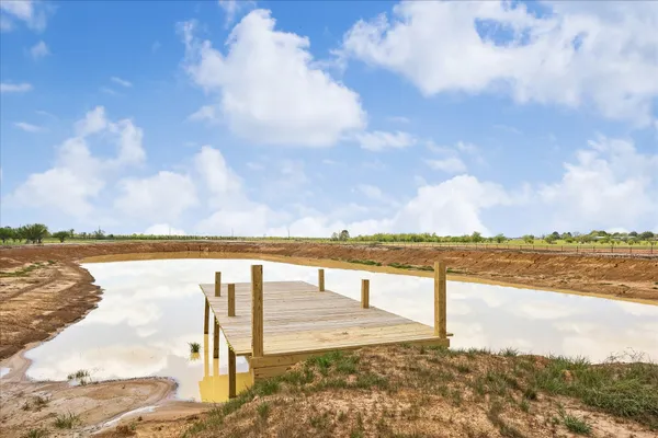 a view of swimming pool from a balcony
